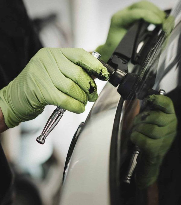 Mechanic removing car wiper arm